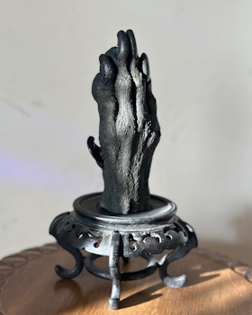 Paw cast with Great Dane on black stand